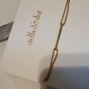 A OS Pulley gold colored multi colored rhinestone bracelet.  Stella & Dot